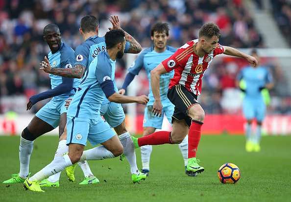 SUNDERLAND, ENGLAND - MARCH 05: Adnan Januzaj of Sunderland (C) attempts to escape the Manchester City defence during the Premier League match between Sunderland and Manchester City at Stadium of Light on March 5, 2017 in Sunderland, England. (Photo by Alex Livesey/Getty Images)